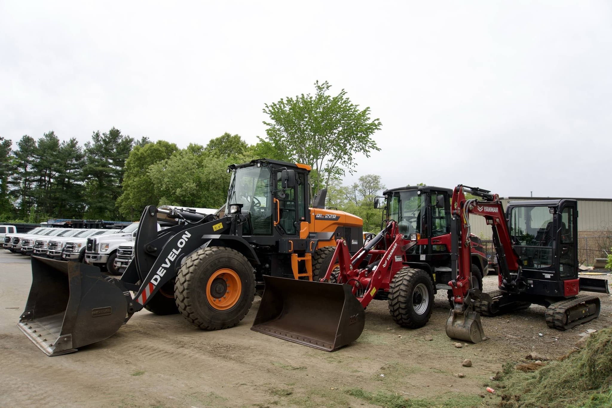 Loaders and excavators at the Hynes Landscaping equipment yard