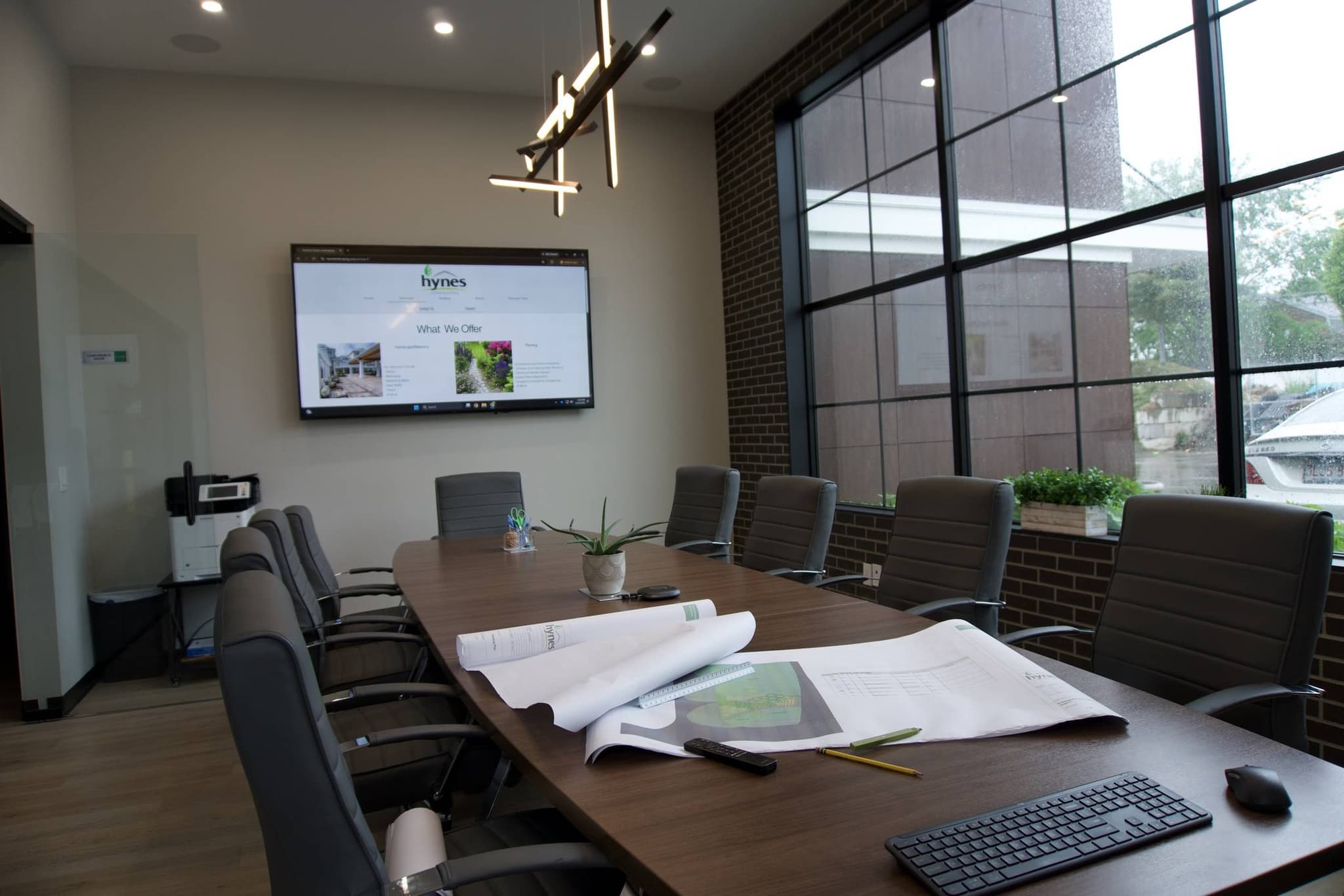 The Hynes Landscaping conference room with landscape plans on the table